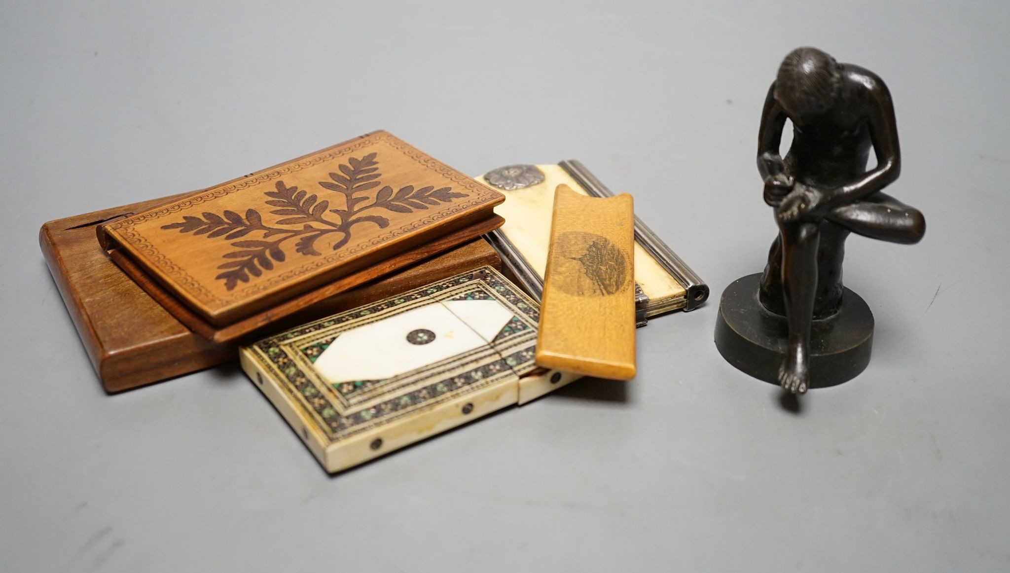 A bronze model, Spinario, 10cm., an ivory aide memoire and card case, wooden cases, etc.